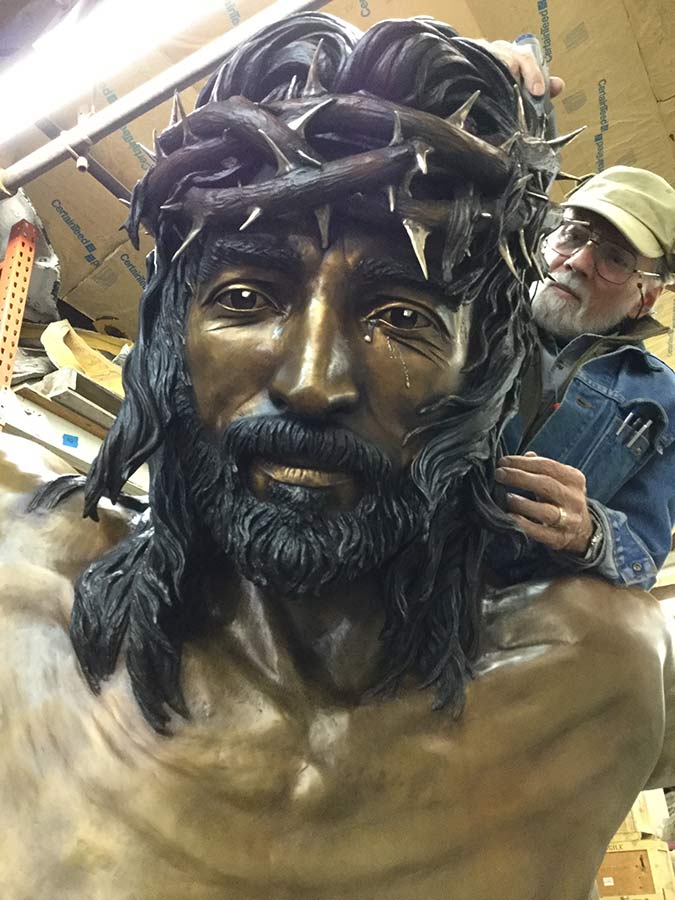 Christ of the Holy Cross a bronze sculpture by James Muir Allegorical Sculpture Artist - James Muir at work on the head of Christ