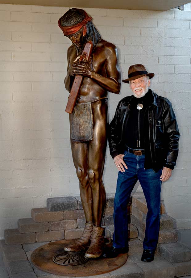 Man in the Maze a life-size bronze sculpture by allegorical artist James Muir